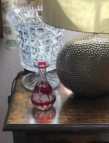 A Bohemian Red Glass Carafe With Grape Leaf Design