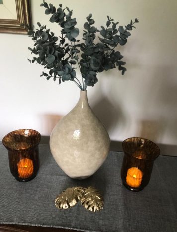 A Sculptural Mottled Cream Vase With A Tapered Neck