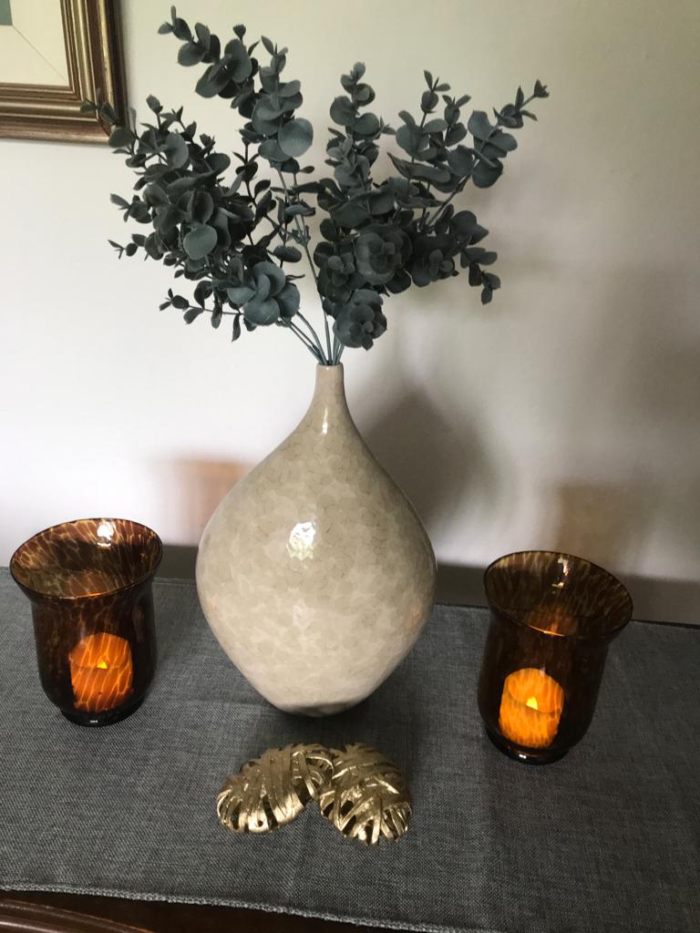 A Sculptural Mottled Cream Vase With A Tapered Neck