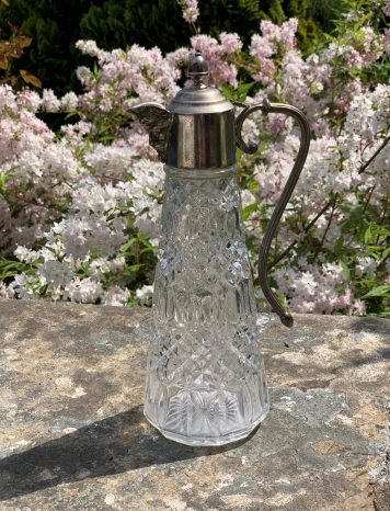 A Cut Glass and Silver Plated Claret Jug with Hooped Handle