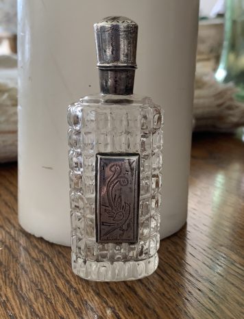 An Elegant Silver Mounted Cut Glass Perfume Bottle