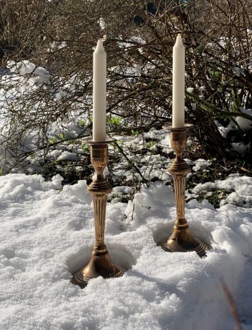 A pair of 18th Century Seamed Bell Metal Candlesticks, on Circular Bases
