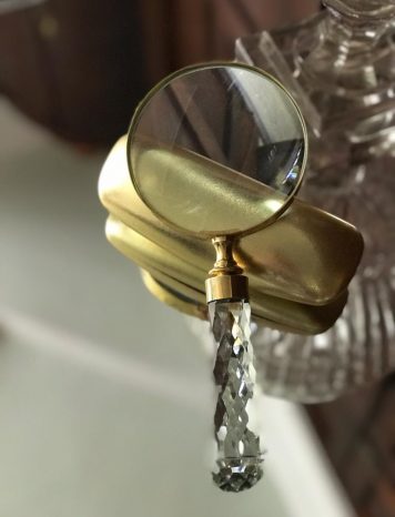 A Large Cut Glass Handle Magnifying Glass with Brass Outer Ring and Trim