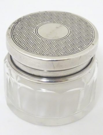A small glass vanity jar with silver lid, hallmarked Birmingham 1927