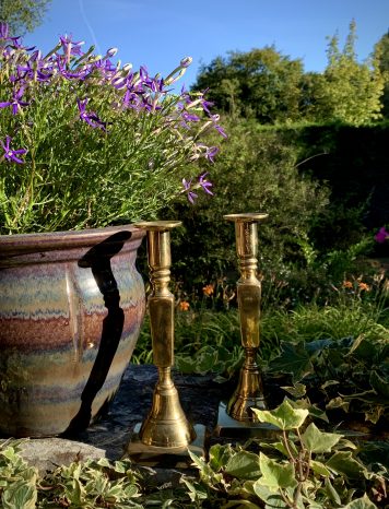 A lovely pair of early 19th Century Brass Candlesticks on square bases