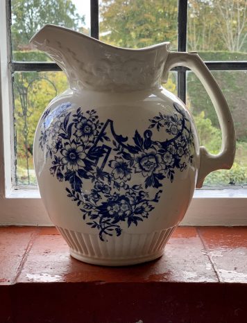 A Vintage Blue & White Porcelain Pitcher with floral decorations