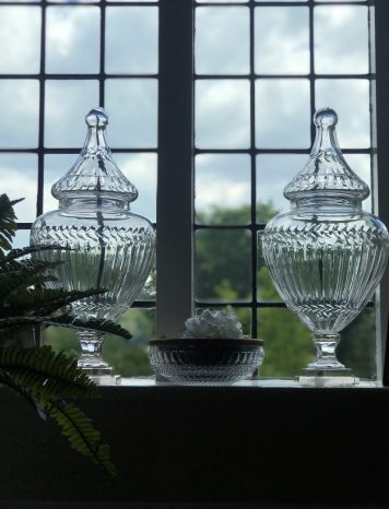 A Fine Pair of Cut Glass Pedestal Jars and Covers