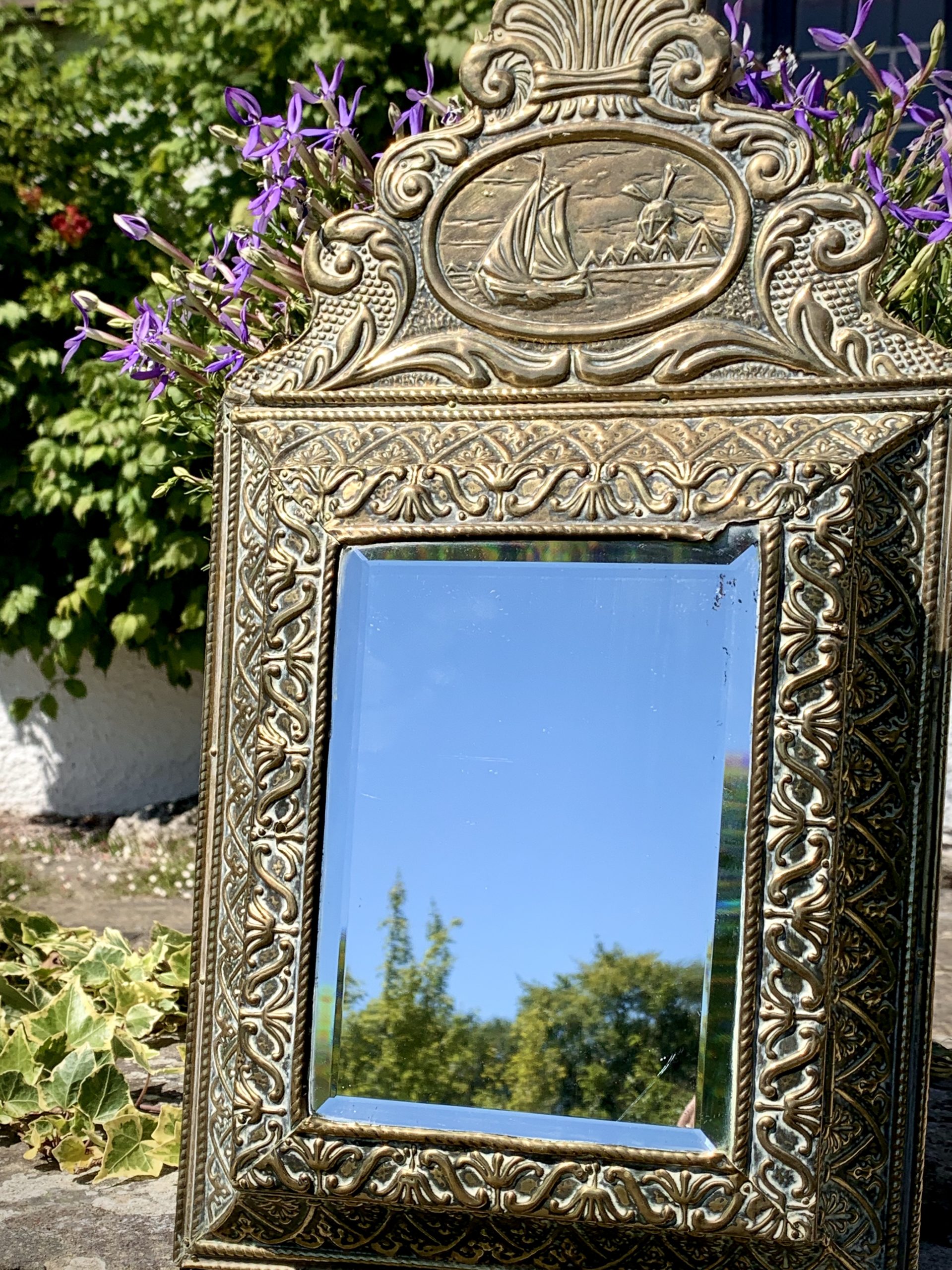 Antique Embossed Dutch Brass Cushion Mirror with Ornate Brushes